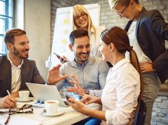 Take a look at this numbers Creative business team working on project. Creative director is showing chart to the workers.